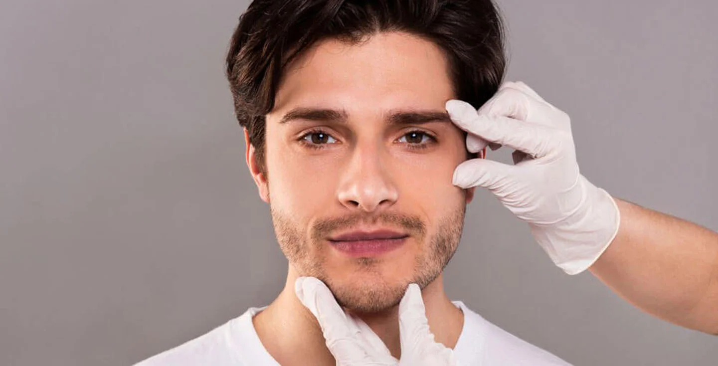 Man getting his face examined