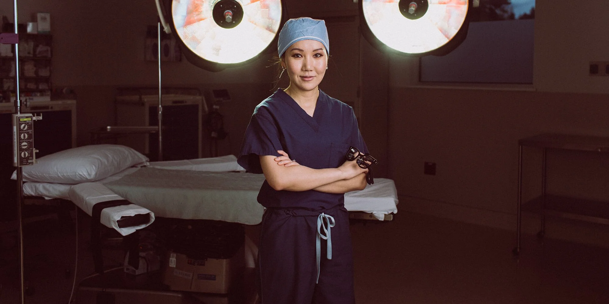 Portrait of Dr. Yirae Ort in surgical scrubs in her operating room